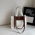 Large canvas tote bag with brown leather handles and adjustable shoulder straps - White