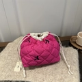 Pink quilted tote bag with black bow embroidery and drawstring closure on knit surface - Rose Pink
