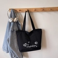 Bolso tote negro minimalista de lona con estampados de corazones y estrellas blancas - Negro