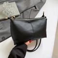 Minimalist black lychee texture underarm bag with gold zipper and shoulder strap details - Black