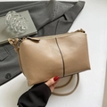 Minimalist beige pebble leather shoulder bag with stylish black contrast stitching - Khaki