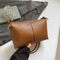 Minimalist brown pebbled leather shoulder bag with vertical black stitching details - Brown