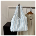 Detail shot of bubble textured tote bag with blue and white stripes in a soft fabric - Blue and White Contrast