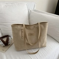 Light khaki corduroy tote bag with vintage texture and stylish brand label detail - Khaki
