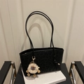 Black leopard print tote bag with plush alpaca charm and twin shoulder straps - Black with Pendant