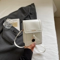 White vertical mini crossbody phone bag in glossy faux leather with a round metal pendant - Off White