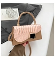 Detail of crocodile textured flap and gold geometric lock on the khaki handbag - Khaki