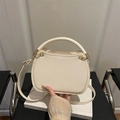 Minimalist cream white leather handbag with elegant gold ring hardware and shoulder strap - White