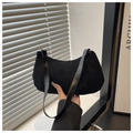 Close-up of black suede hobo bag with smooth leather strap and silver metal rings - Black
