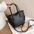 Chic black litchi pattern leather tote bag with gold hardware and shoulder strap - Black