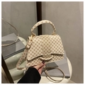 Detail of cream-colored crossbody bag with brown geometric print and round handle - Round White