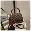 Detail of vintage brown monogram handbag with adjustable strap and gold buckle - Style M Coffee