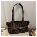 Detail of leopard print tote bag with brown faux leather trim and metallic buckle - Brown