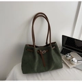 Detail of dark green suede tote bag with brown leather straps and silver metal hardware - Green
