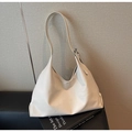 Detail view of the cream leather tote bag featuring adjustable strap and silver metal hardware - Off White