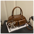 Brown glossy Boston bag with flap pockets and a removable pearl bow keychain detail - Brown
