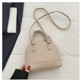 Beige crocodile embossed shell bag with a top handle and matching shoulder strap - Khaki