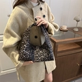 Fashionable leopard print oversized handbag in a minimalist indoor setting for autumn - Gray