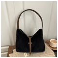 Black corduroy hobo shoulder bag with brown leather strap in a warm cozy setting - Black