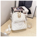 Detail of white PU leather mini backpack featuring V-quilted texture and gold M-logo - White