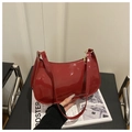Chic red patent leather underarm bag with high-gloss finish and metal zipper detail - Red