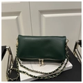 Detail of dark green pebble leather shoulder bag with gold zipper and chain strap - Green