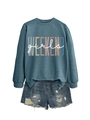 Detail of Weekend Girls lettering on loose crewneck sweatshirt with denim shorts - Blue with White Print