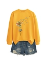 Detail of orange long sleeve sweatshirt with dandelion book print and ripped denim shorts - S / Yellow