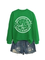 Flat lay detail of green Book Club sweatshirt paired with distressed blue denim shorts - S / Grass Green (White Graphics)