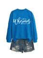 Detail view of blue long sleeve sweatshirt with white religious text and denim shorts - S / Lake Blue (White Text)