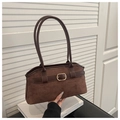 Macro detail of brown suede handbag featuring a refined gold buckle and leather strap - Brown