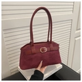 Detail of burgundy suede tote bag featuring a gold square buckle and leather strap - Red