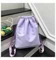 Detail of lavender nylon drawstring backpack with adjustable buckle and pleated design - Purple
