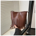 Detailed view of a brown PU leather crossbody bag featuring long stylish tassels and stitching - Brown