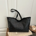 Minimalist large black tote bag with circular embossed logo for commute and daily use - Black