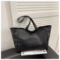 Black large capacity faux leather tote bag with embossed round logo and thin straps - Black