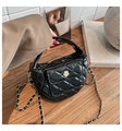 Detailed macro view of black quilted leather moon bag with golden flower lock and metal chain - Black