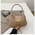 Detail of woven texture handbag featuring a gold square twist lock and khaki braided finish - Khaki