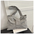 Detailed view of grey tote bag with bow knot and pleated high-density nylon fabric - Gray