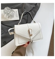 White woven texture crossbody bag with gold hardware and envelope flap detail - White