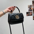 Classic black quilted leather handbag with gold M logo and elegant top handle for women - Black