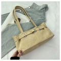 Detail of beige suede underarm bag with silver buckle and sleek decorative strap - Khaki