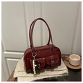Dark red patent leather Boston bag with double front pockets and beaded charm detail - Red
