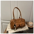 Brown glossy Boston bag with double front pockets and beaded charm on beige fabric - Brown