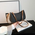 Chic black canvas baguette bag with brown faux leather straps and silver buckle detail - Black