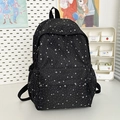 Minimalist black backpack with white star pattern and multiple storage pockets - Black