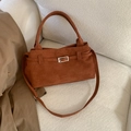 Brown faux suede handbag with silver buckle shown on sofa with khaki trench coat - No Pendant / Brown