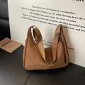 Brown suede hobo shoulder bag with wide strap and tassel detail in retro style - Brown