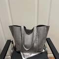 Grey large capacity tote bag with silver studs on chair, minimalist rock style aesthetic - Gray