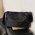 Chic black nylon crossbody bag featuring trendy white star print and wide shoulder strap - Black